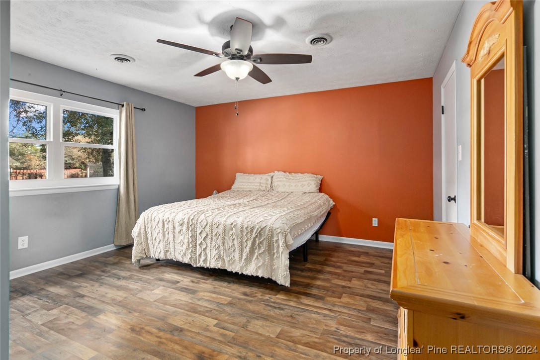 3009 Rouse Road Fayetteville, NC 28306 - Photo 26 of 37 a bedroom with a bed and a large window