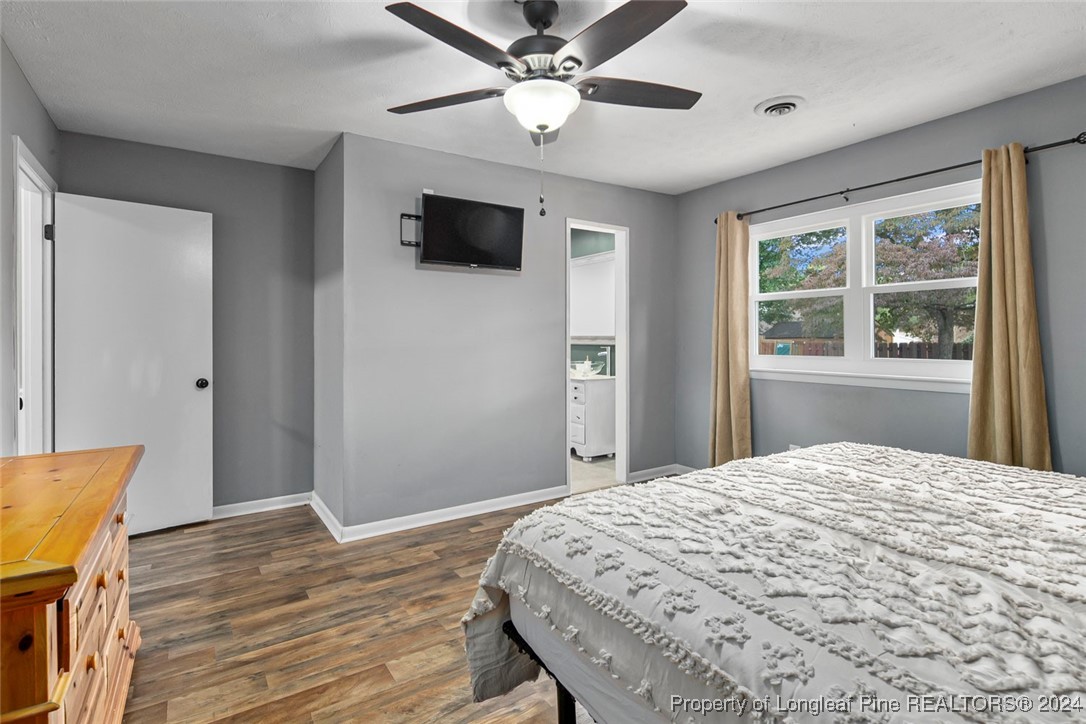 3009 Rouse Road Fayetteville, NC 28306 - Photo 27 of 37 a bedroom with a bed and a flat screen tv