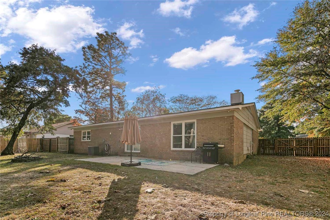 3009 Rouse Road Fayetteville, NC 28306 - Photo 36 of 37 a view of a yard with a house and a tree