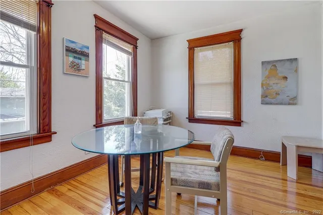 a dining room with furniture and window