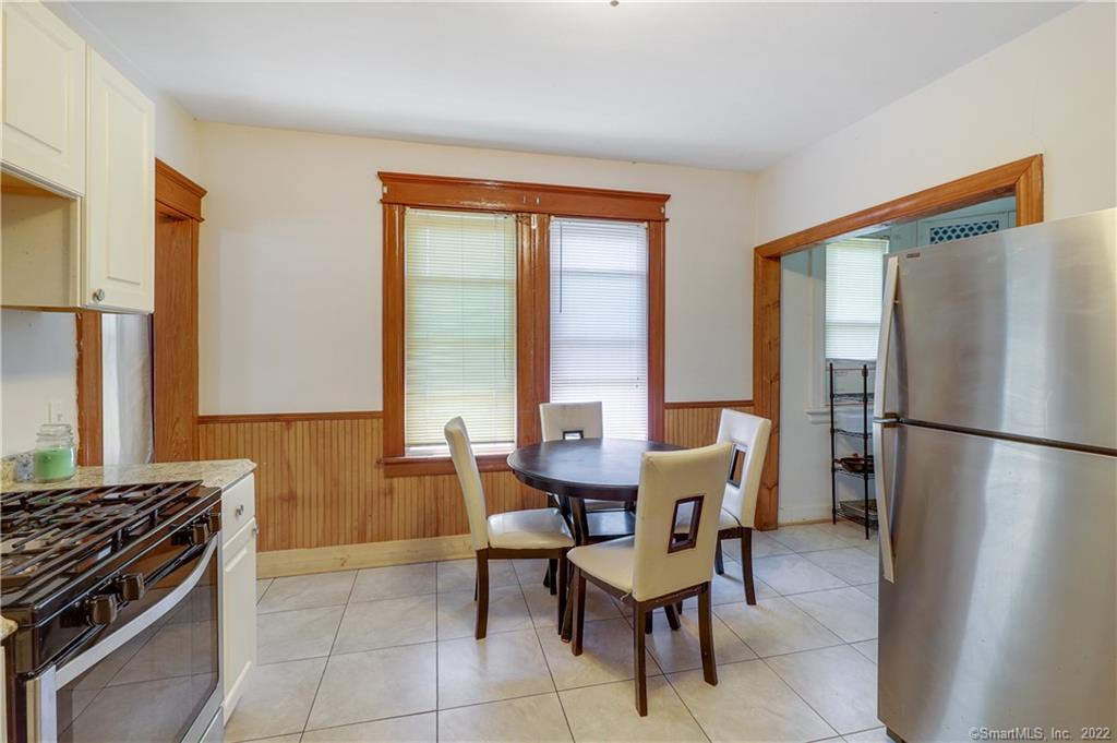 19 5th Street Ansonia, CT 06401 - Photo 15 of 38 a kitchen with stainless steel appliances granite countertop a refrigerator and a stove top oven