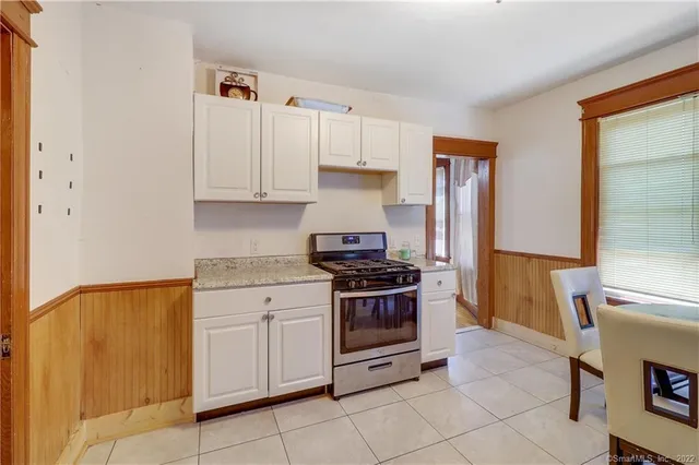 a kitchen with cabinets and appliances