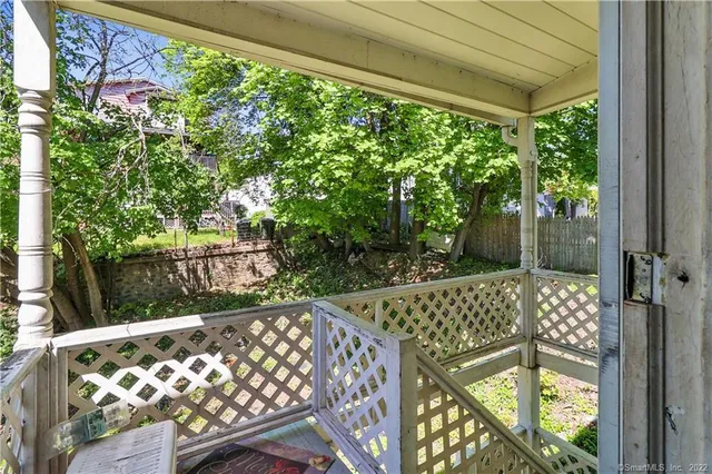 a view of balcony with wooden floor