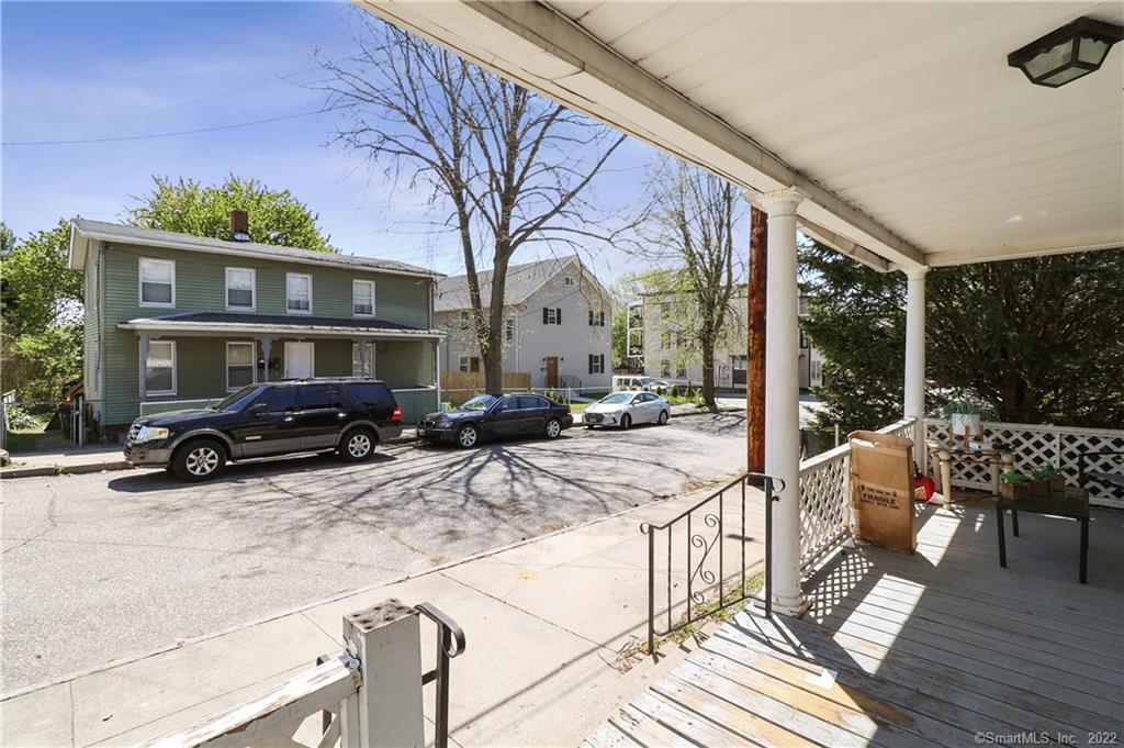 19 5th Street Ansonia, CT 06401 - Photo 2 of 38 a view of a patio with couches under an umbrella