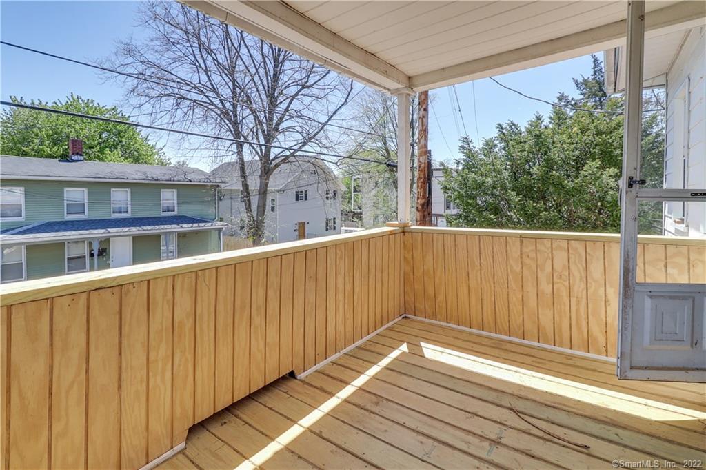 19 5th Street Ansonia, CT 06401 - Photo 21 of 38 a view of wooden balcony with a trees