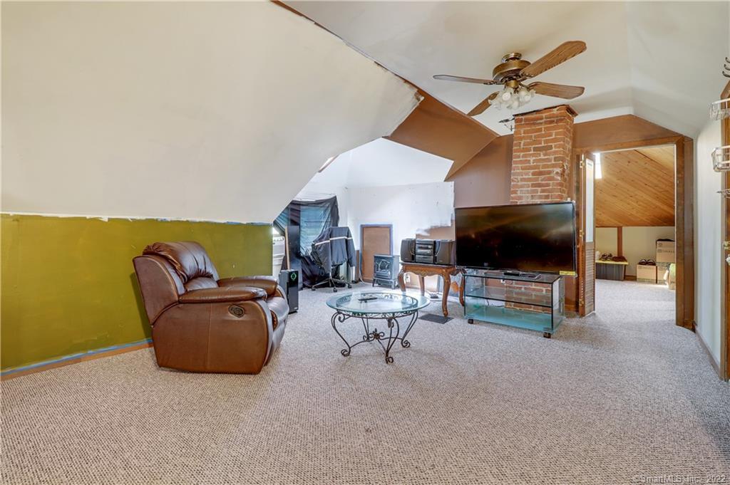 19 5th Street Ansonia, CT 06401 - Photo 26 of 38 a living room with furniture and a flat screen tv