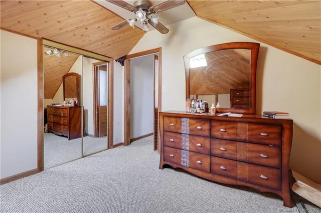 an empty room with furniture and a window