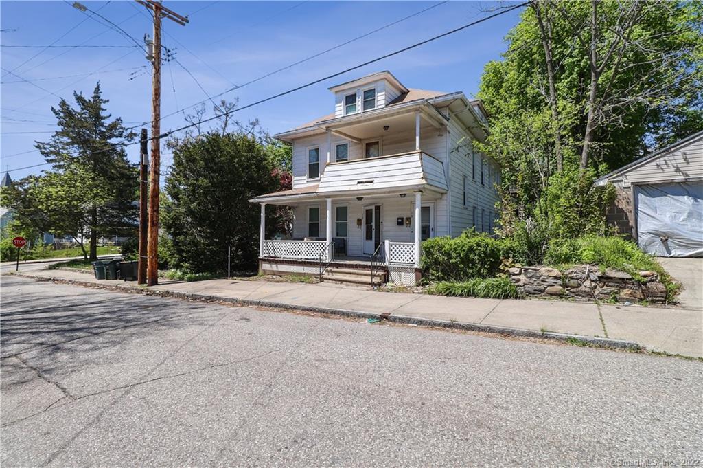 19 5th Street Ansonia, CT 06401 - Photo 3 of 38 a front view of a house with a garden