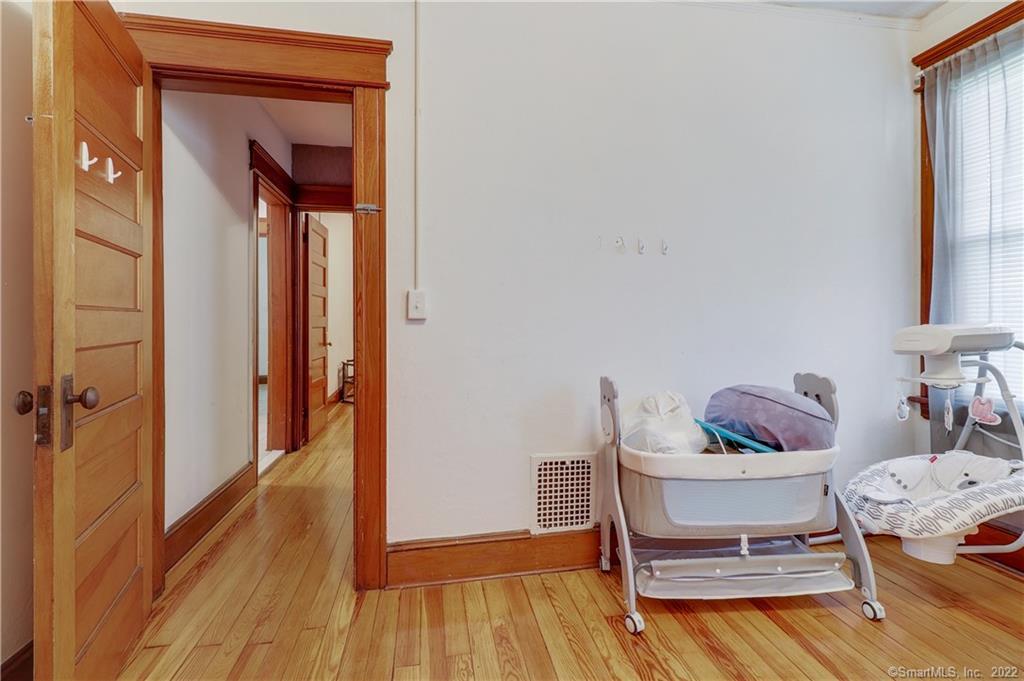 19 5th Street Ansonia, CT 06401 - Photo 32 of 38 a dining room with furniture and wooden floor