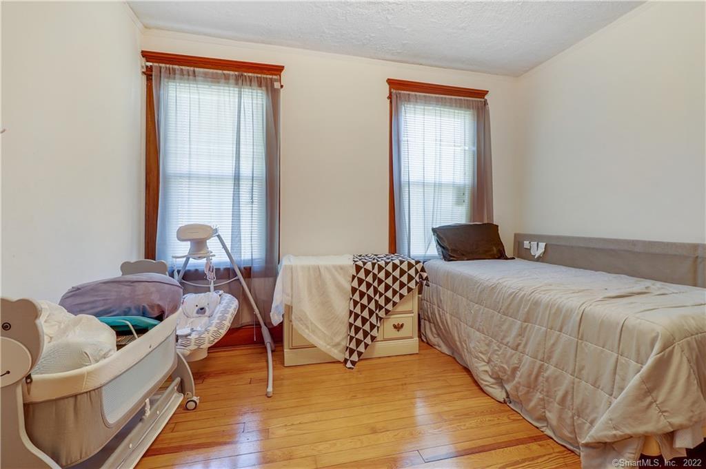 19 5th Street Ansonia, CT 06401 - Photo 33 of 38 a bedroom with a bed and a window