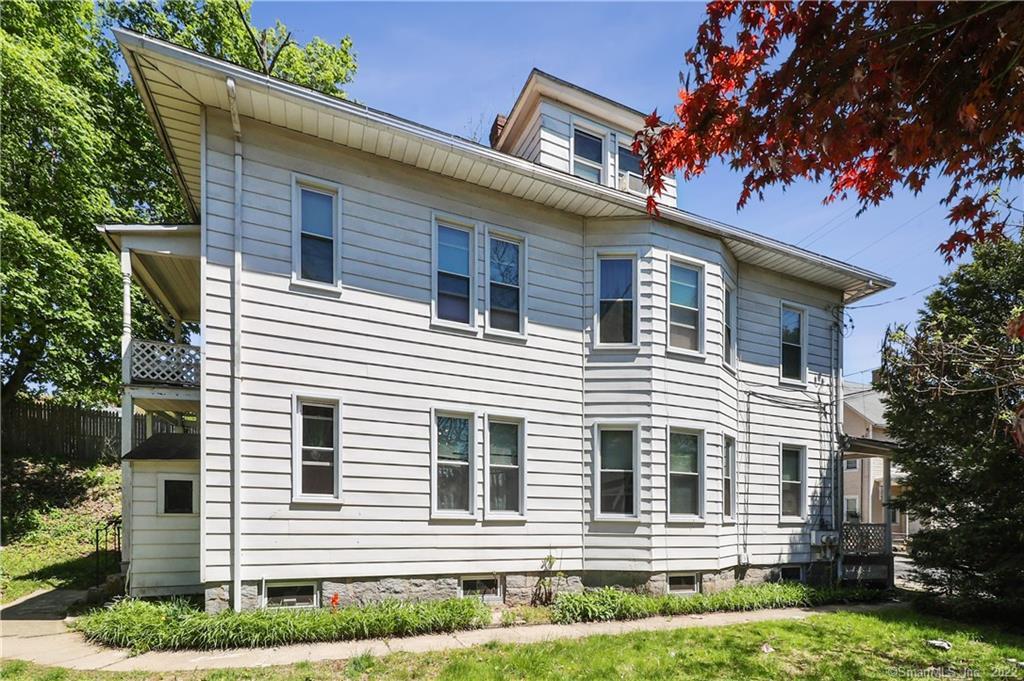 19 5th Street Ansonia, CT 06401 - Photo 36 of 38 a front view of a house with a yard