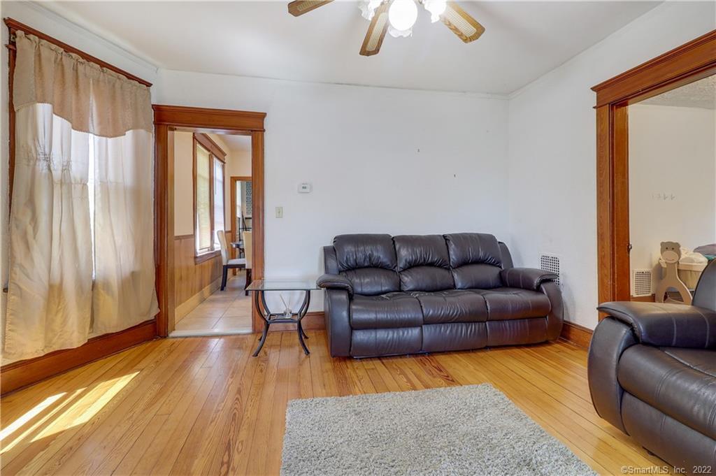 19 5th Street Ansonia, CT 06401 - Photo 10 of 38 a living room with furniture and a wooden floor