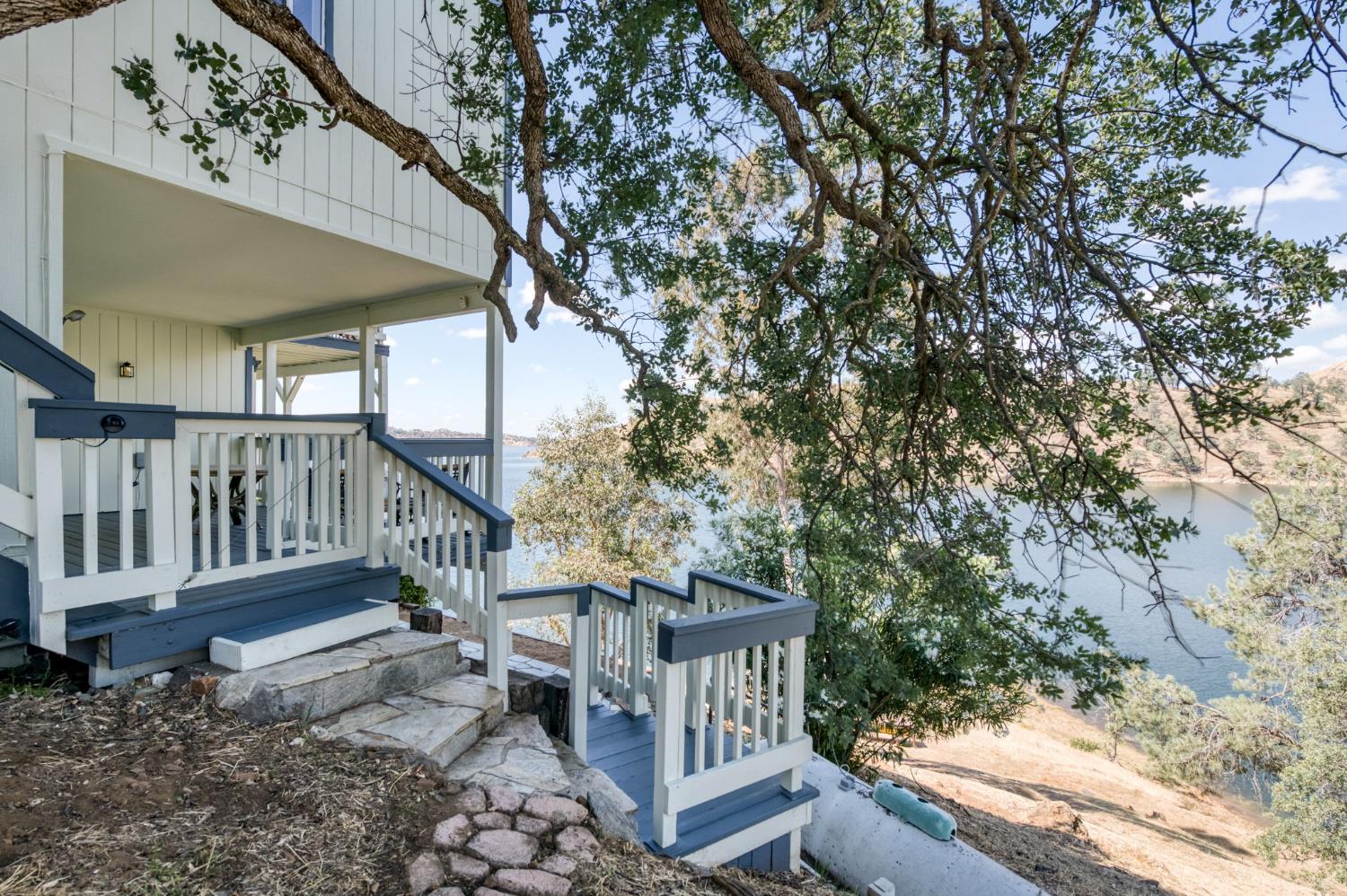 28037 Sky Harbour Road Friant, CA 93626 - Photo 31 of 40 a view of a house with a yard and wooden deck