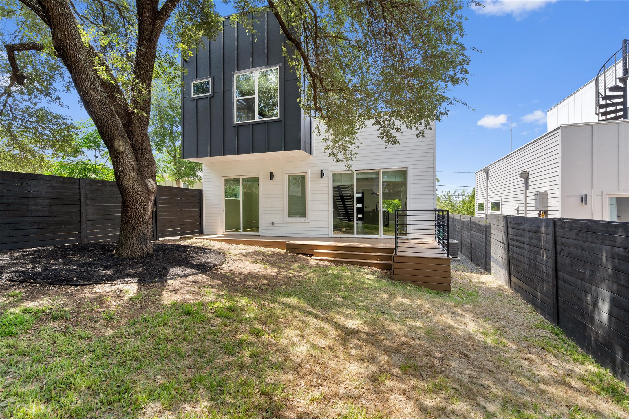 4712 Reyes Street, Unit 1 Austin, TX 78721 - Photo 32 of 38 a view of a house with a yard