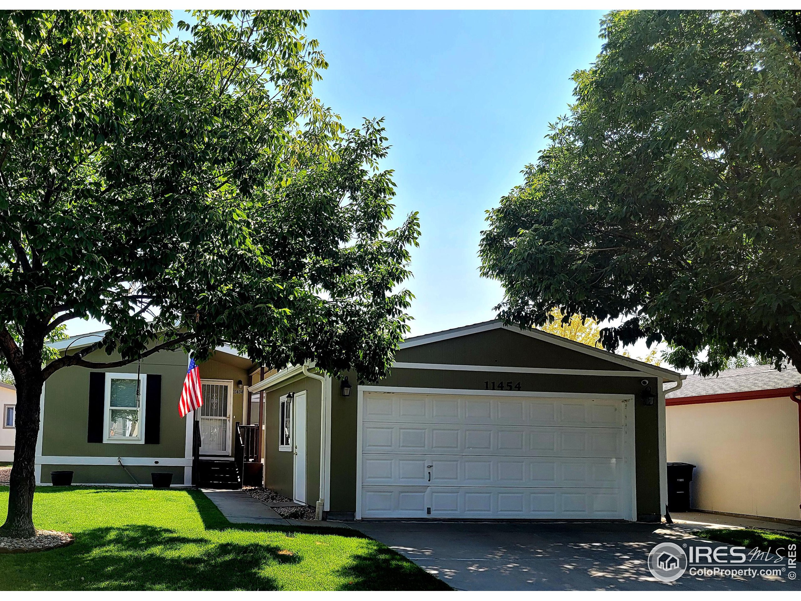 11454 Far View, Unit 100 Longmont, CO 80504 - Photo 1 of 33 a front view of house with yard