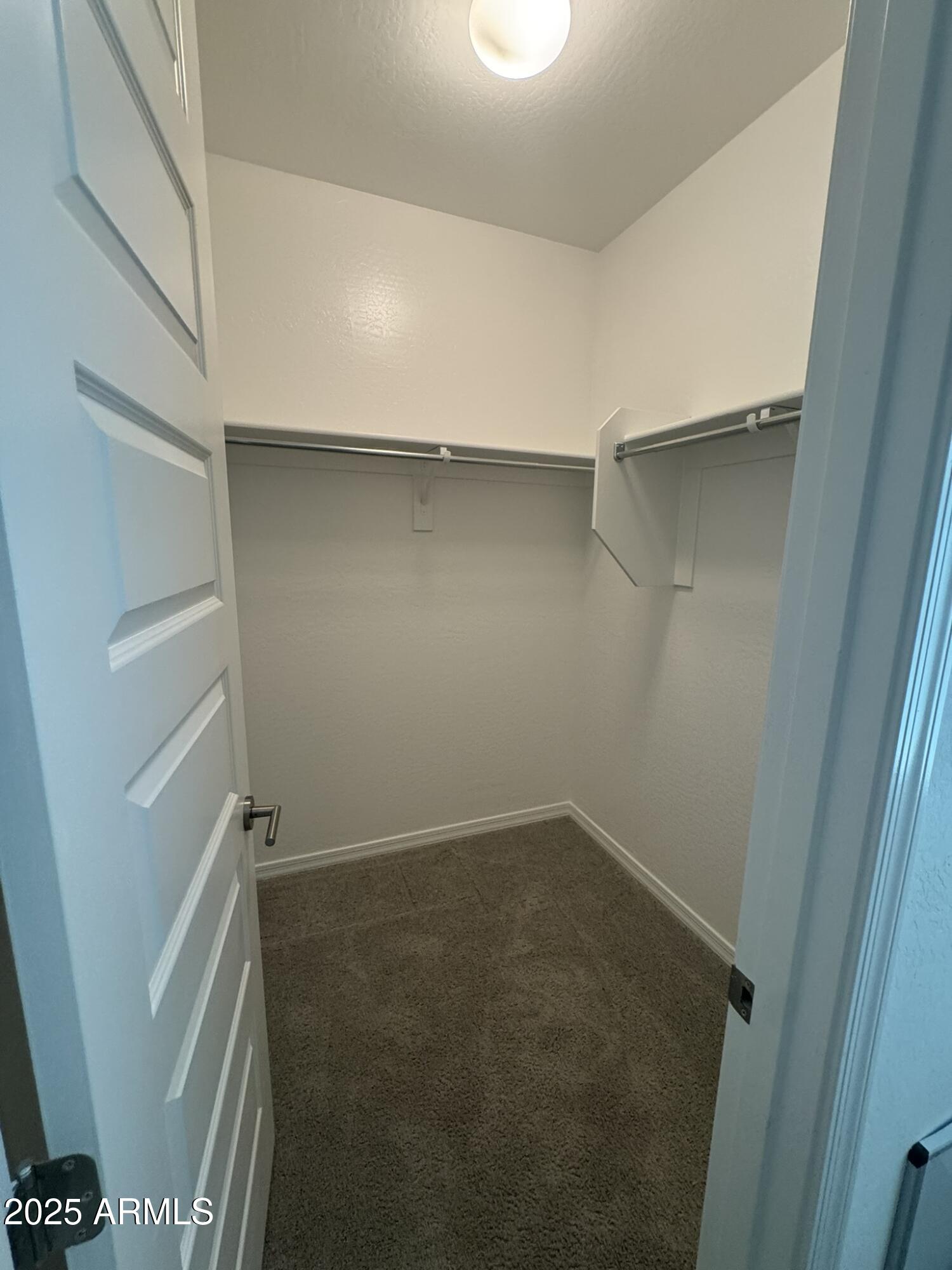 22742 East Domingo Road Queen Creek, AZ 85142 - Photo 11 of 23 a view of an empty walk in closet