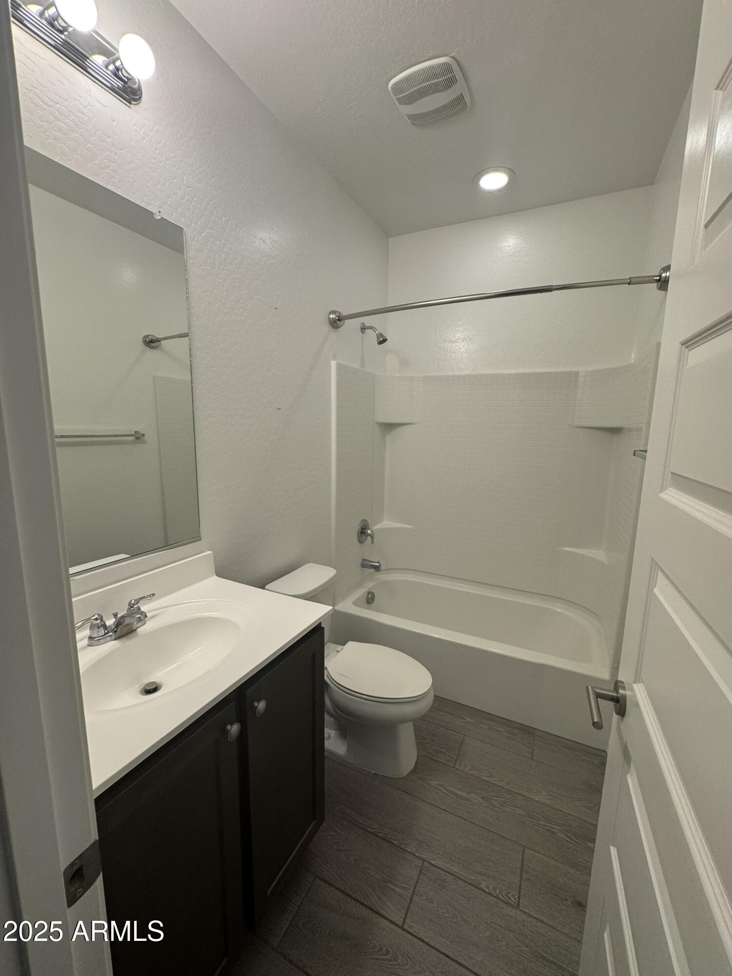 22742 East Domingo Road Queen Creek, AZ 85142 - Photo 15 of 23 a bathroom with a sink a toilet and shower