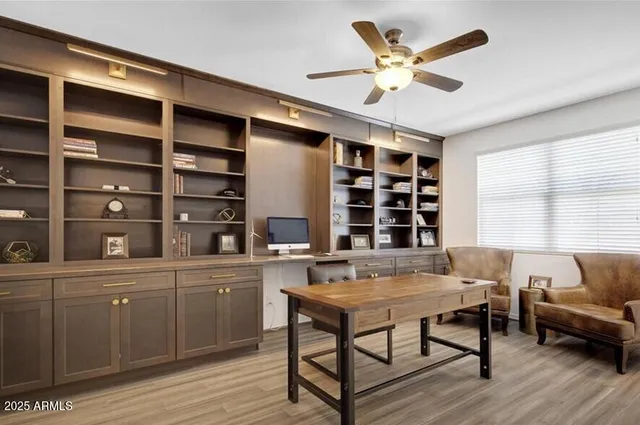 a workspace with furniture and window