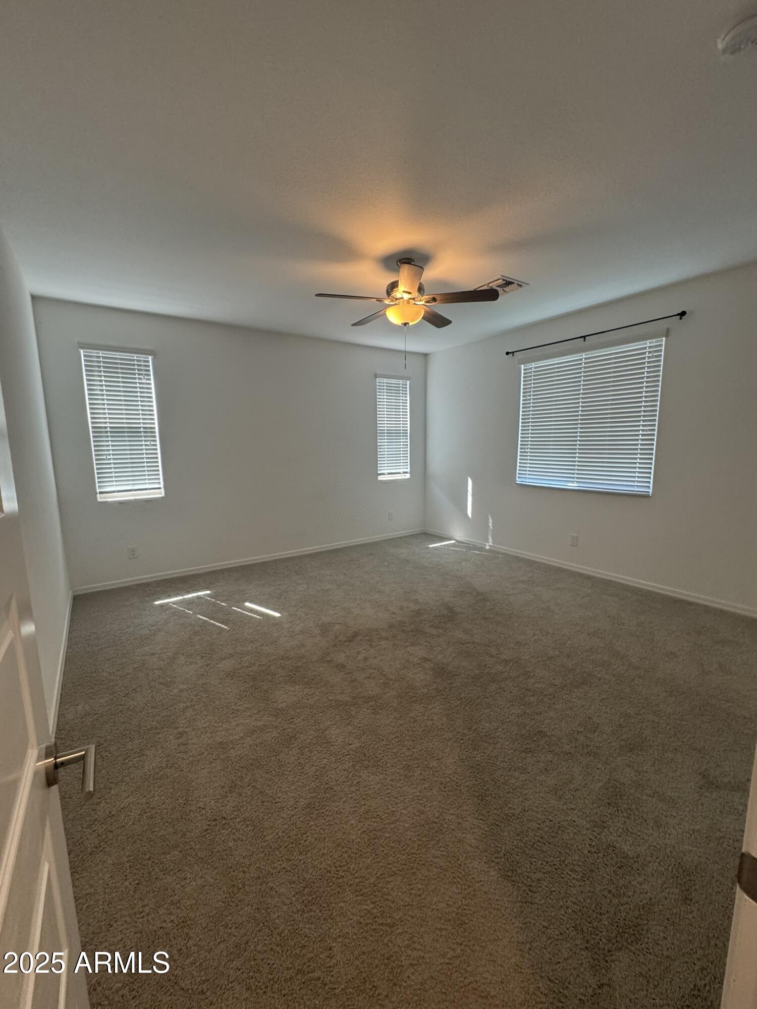 22742 East Domingo Road Queen Creek, AZ 85142 - Photo 7 of 23 a view of empty room with window and fireplace