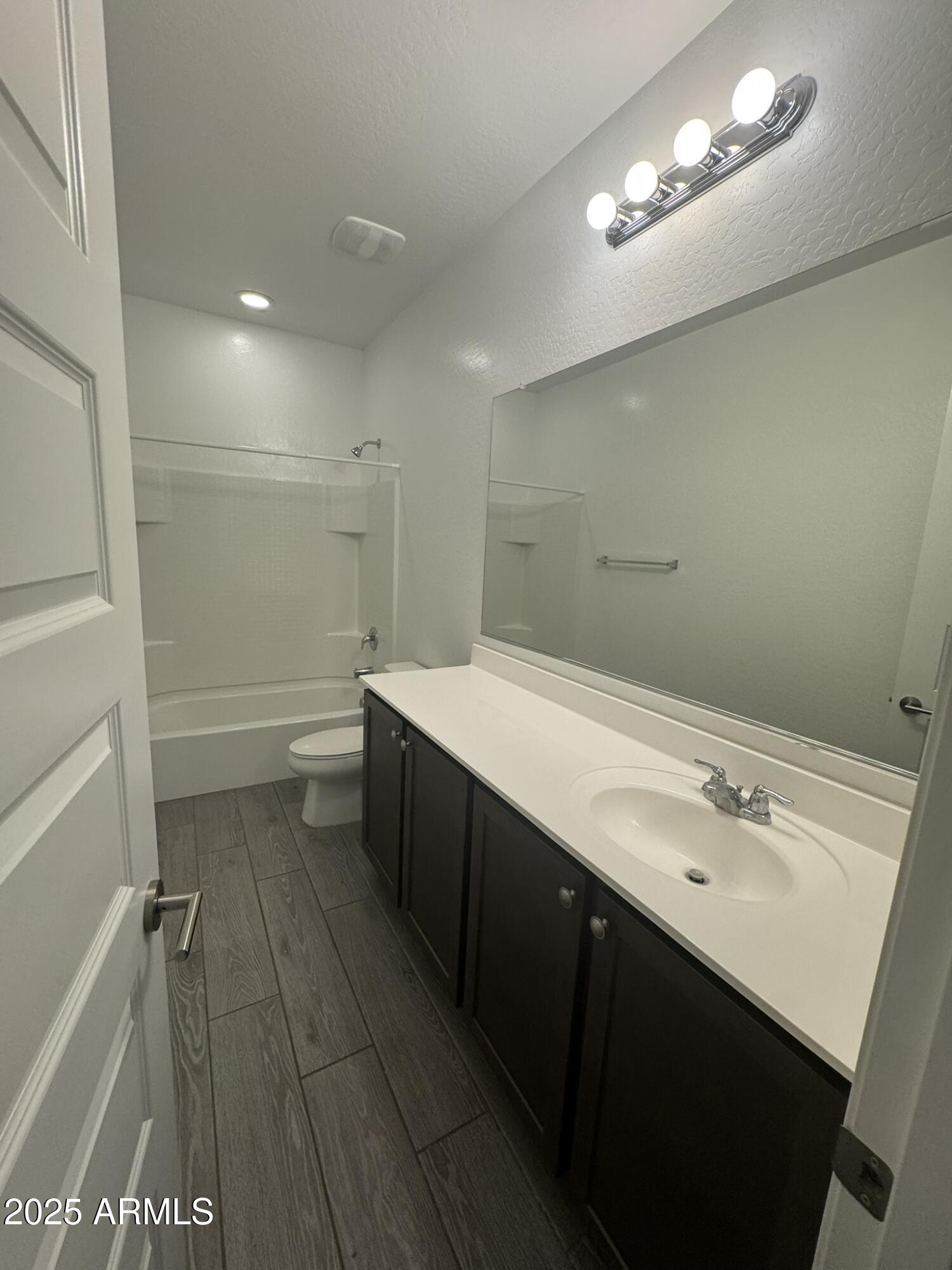 22742 East Domingo Road Queen Creek, AZ 85142 - Photo 9 of 23 a bathroom with a double vanity sink and a mirror