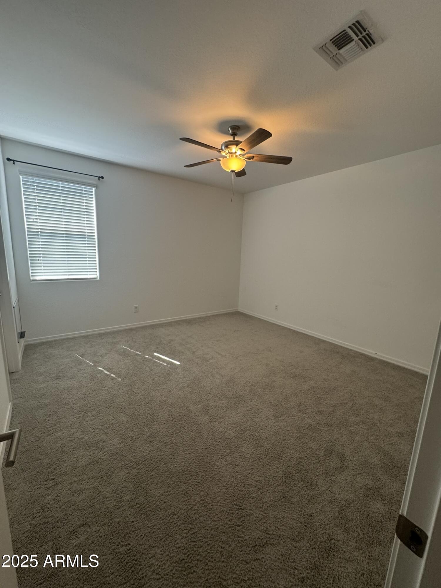 22742 East Domingo Road Queen Creek, AZ 85142 - Photo 10 of 23 an empty room with a natural light