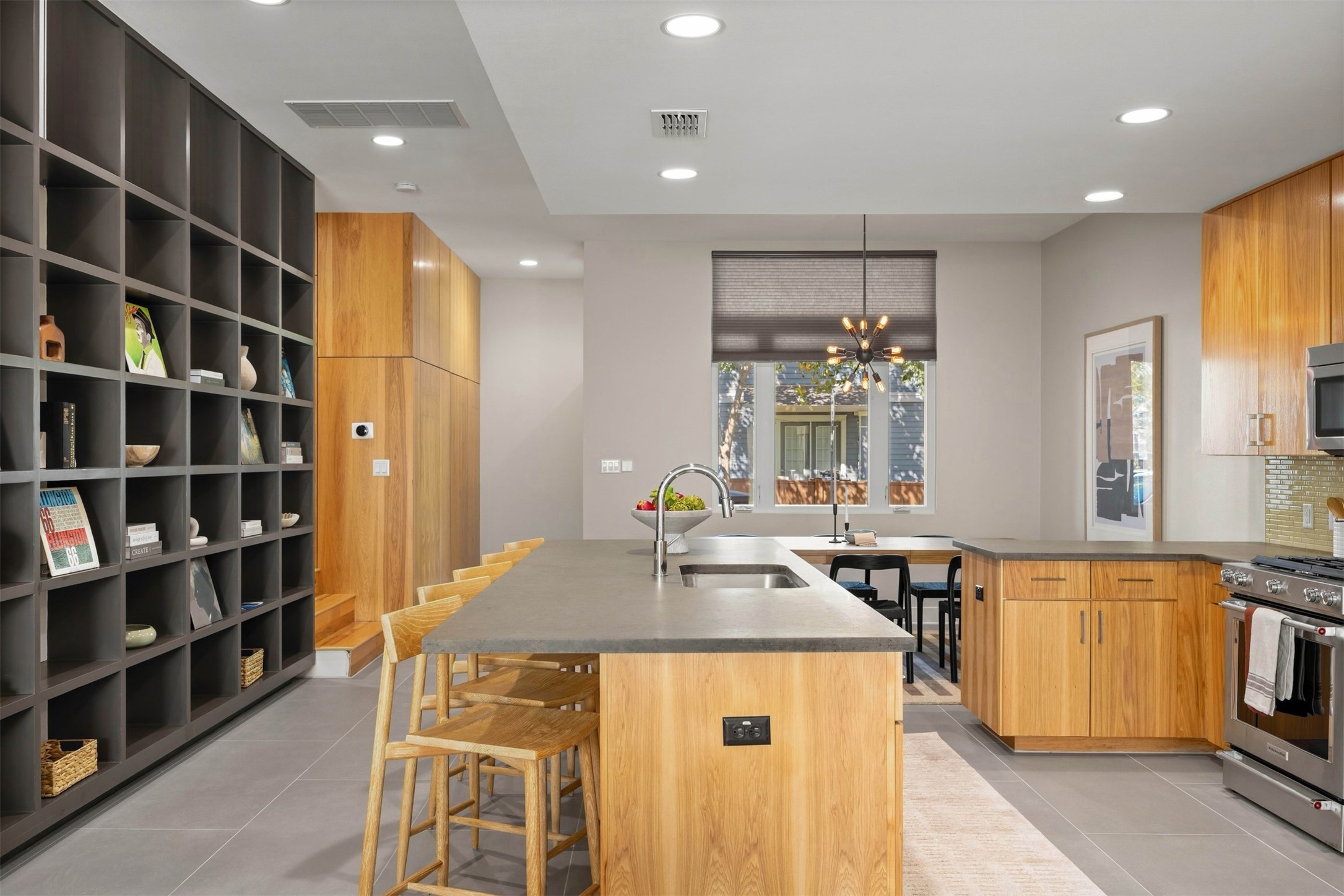 3921 Threadgill Street Austin, TX 78723 - Photo 15 of 36 Tile backsplash and sleek fixtures lend a thoughtful, architectural touch to your daily cooking routine