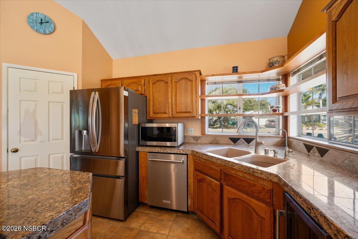 892 Onstott Road Lompoc, CA 93436 - Photo 12 of 40 a kitchen with a sink appliances and cabinets