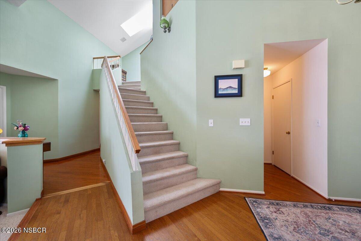 892 Onstott Road Lompoc, CA 93436 - Photo 14 of 40 a view of a hallway with wooden floor and stairs