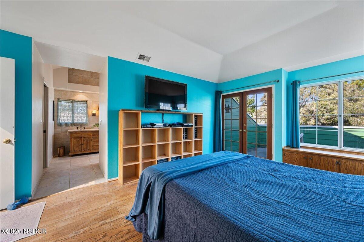 892 Onstott Road Lompoc, CA 93436 - Photo 16 of 40 a bedroom with a large bed and a flat tv screen