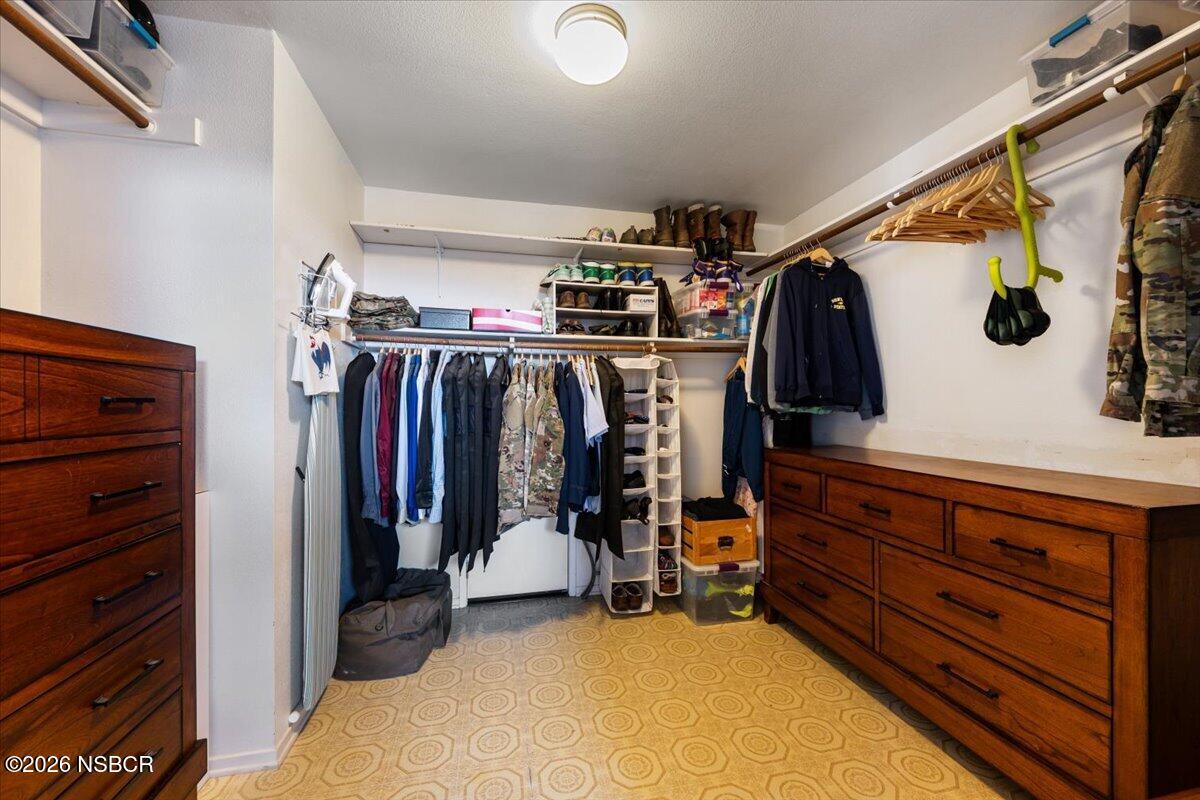 892 Onstott Road Lompoc, CA 93436 - Photo 20 of 40 a view of walk in closet with clothes and shoes