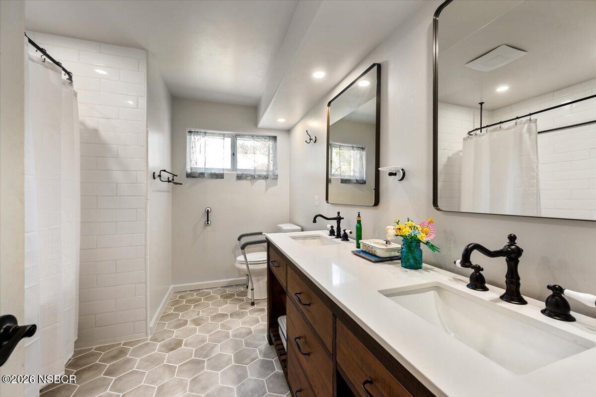 892 Onstott Road Lompoc, CA 93436 - Photo 22 of 40 a bathroom with a sink double vanity and a mirror