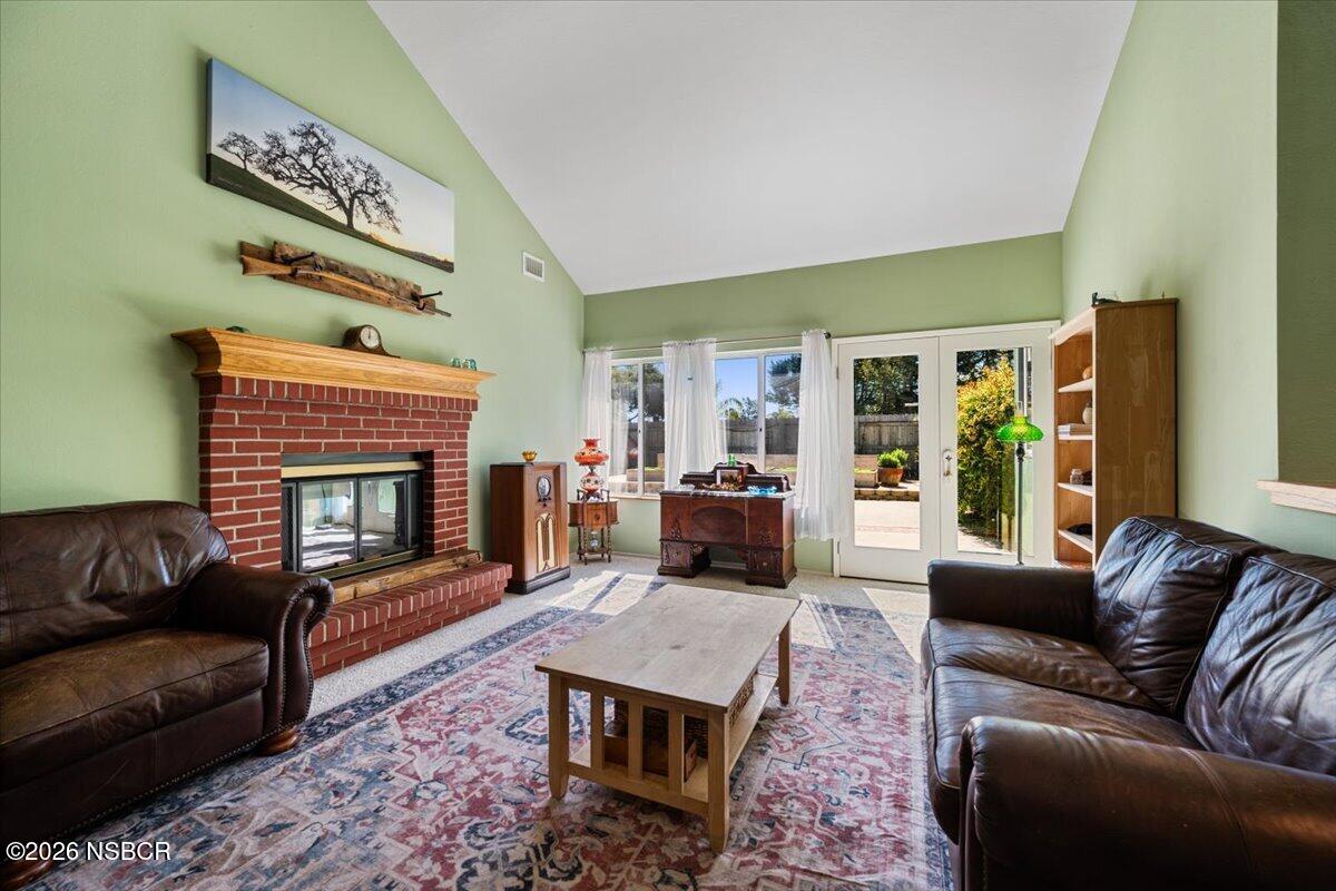 892 Onstott Road Lompoc, CA 93436 - Photo 5 of 40 a living room with furniture or couch and a fireplace