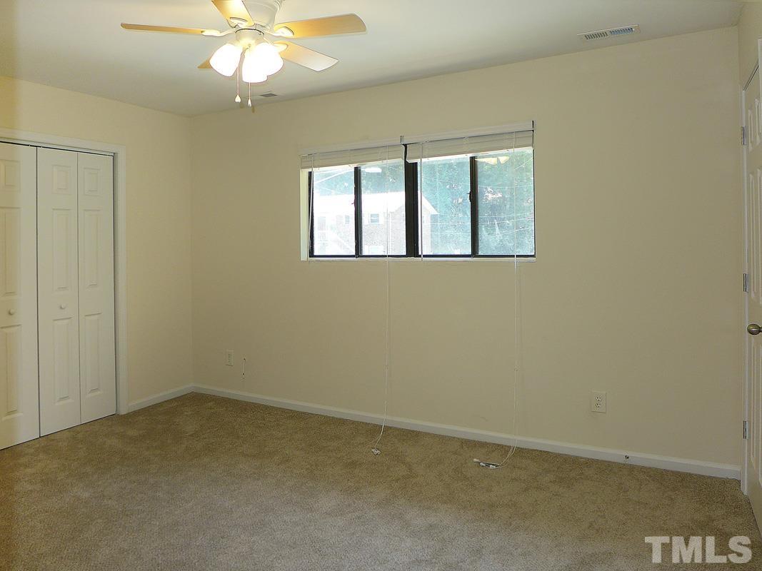 138 Johnson Street, Unit A Chapel Hill, NC 27516 - Photo 11 of 20 an empty room with a window