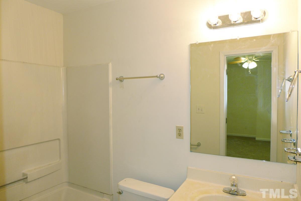 138 Johnson Street, Unit A Chapel Hill, NC 27516 - Photo 14 of 20 a bathroom with a sink and a mirror