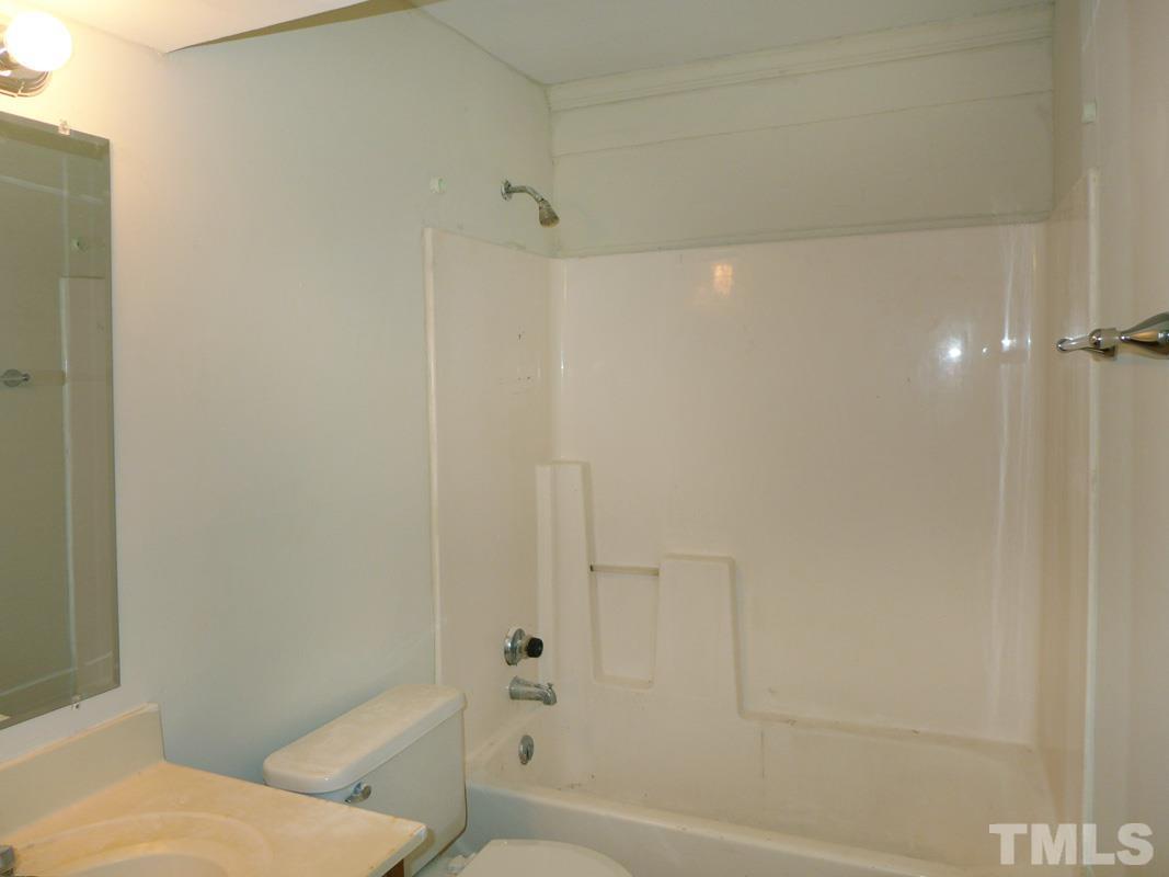 138 Johnson Street, Unit A Chapel Hill, NC 27516 - Photo 16 of 20 a bathroom with a shower and a toilet