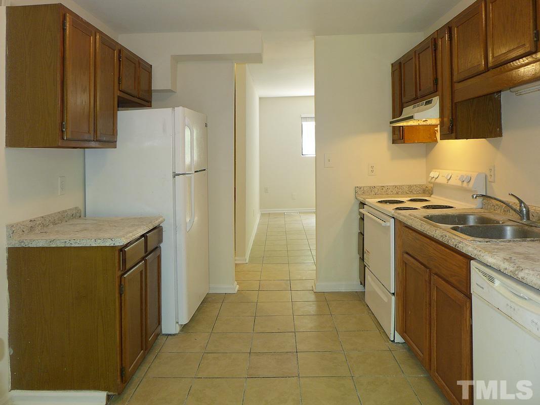 138 Johnson Street, Unit A Chapel Hill, NC 27516 - Photo 6 of 20 a kitchen with stainless steel appliances granite countertop a refrigerator and a stove
