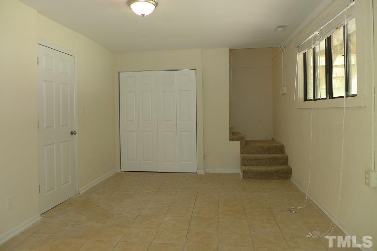 138 Johnson Street, Unit A Chapel Hill, NC 27516 - Photo 7 of 20 an empty room with windows