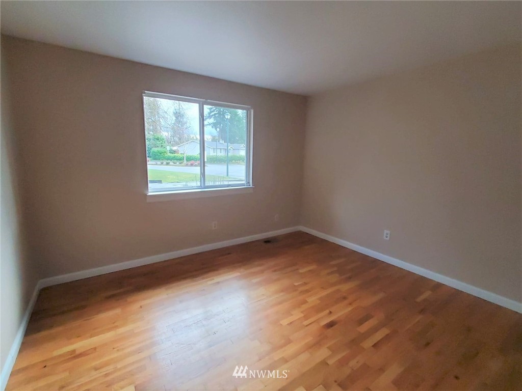 17036 138th Place Southeast Renton, WA 98058 - Photo 22 of 36 an empty room with a window