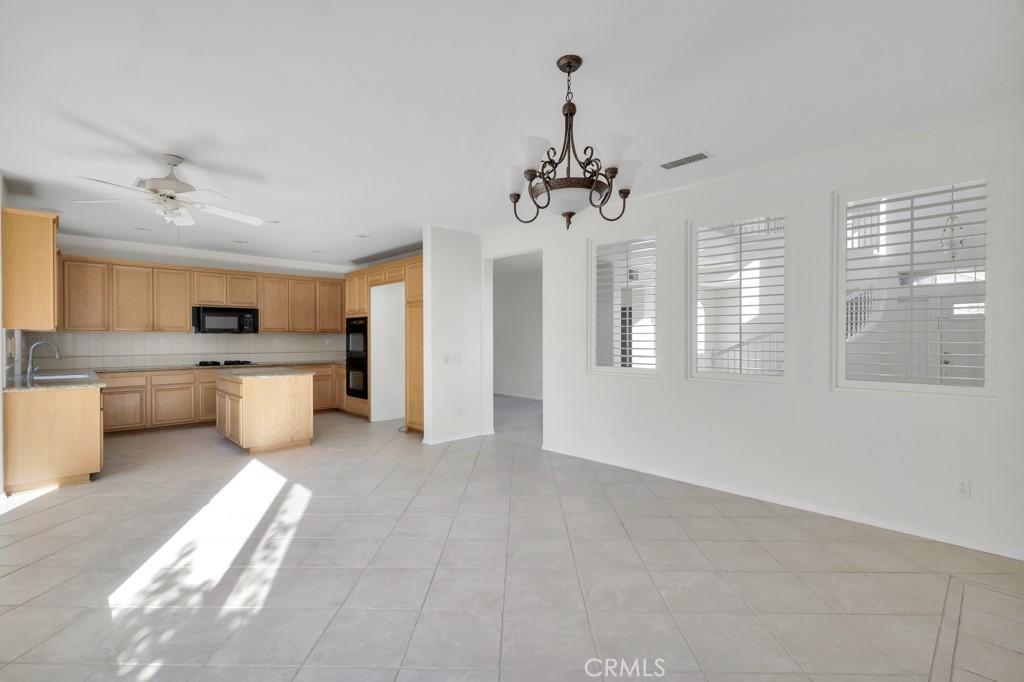 11205 Salerno Porter Ranch Porter Ranch, CA 91326 - Photo 15 of 43 a view of a kitchen with a sink dishwasher a refrigerator and a large window