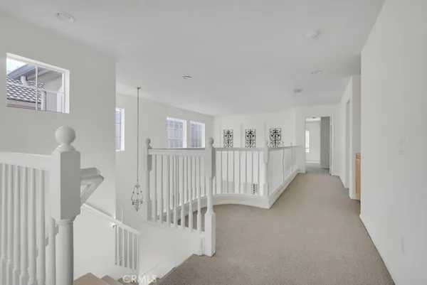 a view of a hallway with windows