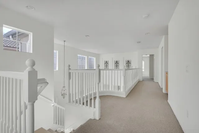 a view of a hallway with windows