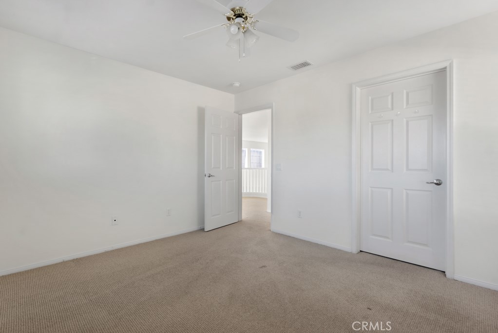 11205 Salerno Porter Ranch Porter Ranch, CA 91326 - Photo 30 of 43 a view of a room with a ceiling fan