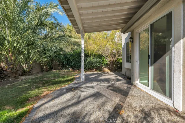 a view of a house with backyard and porch