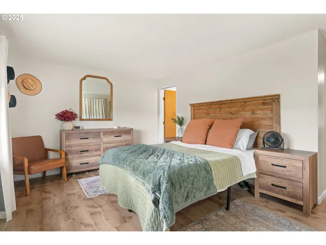 a bedroom with a bed and a chair