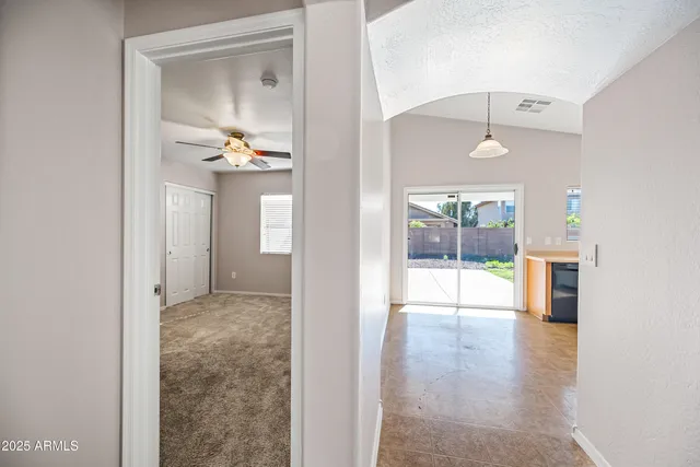 a view of a hallway view with wooden floor and staircase