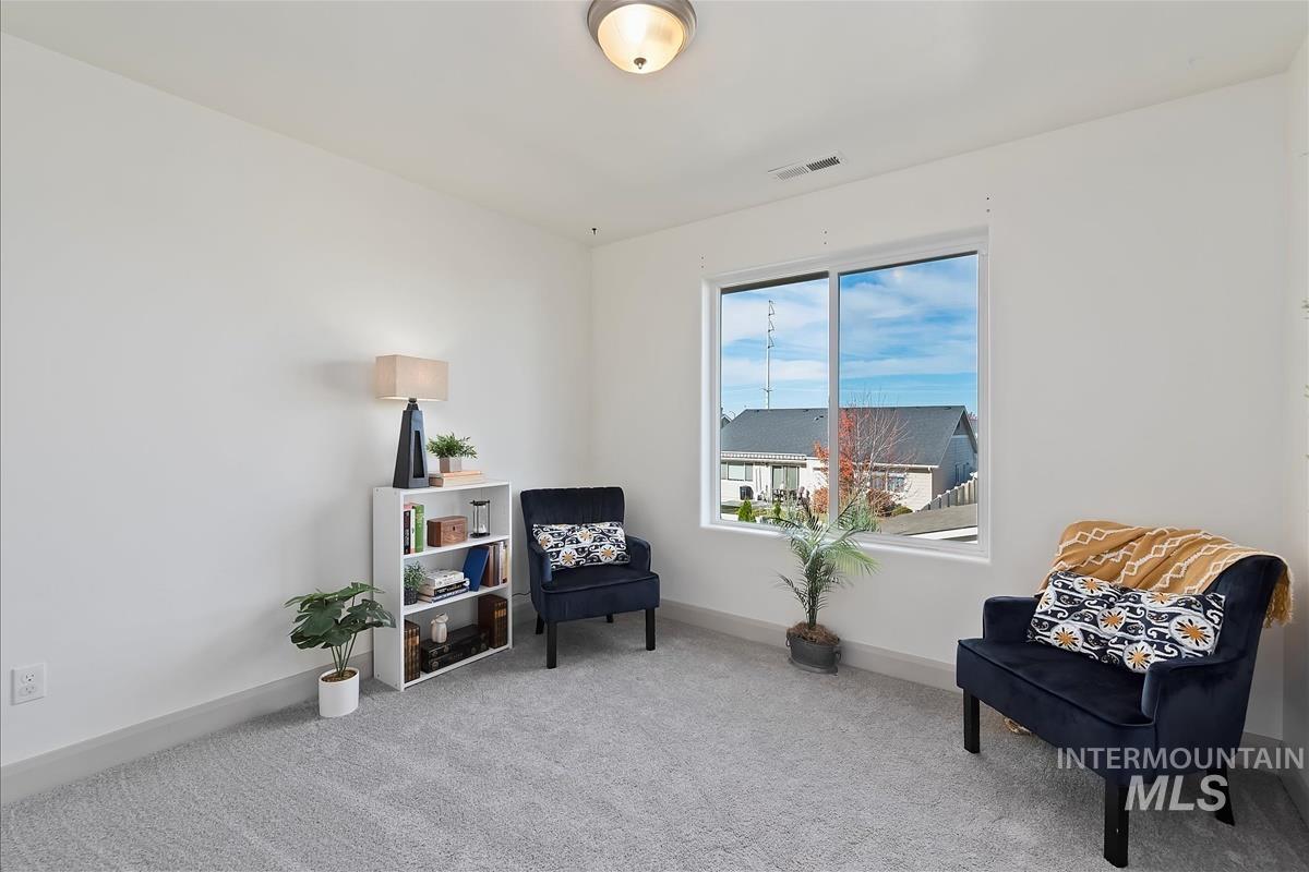 5932 West Quintale Drive Meridian, ID 83646 - Photo 16 of 40 Sitting room featuring carpet floors and baseboards