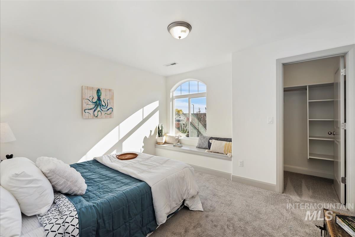 5932 West Quintale Drive Meridian, ID 83646 - Photo 21 of 40 Bedroom with a spacious closet and carpet floors