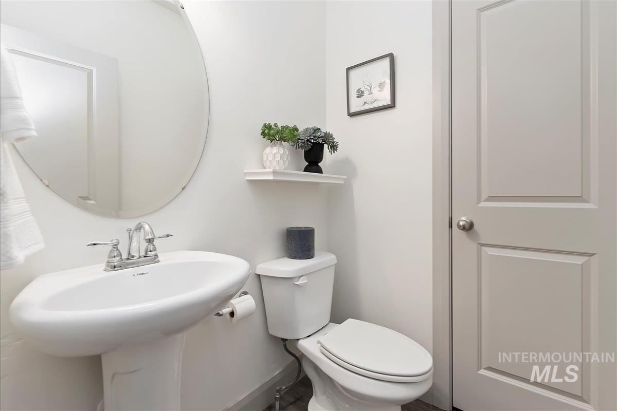 5932 West Quintale Drive Meridian, ID 83646 - Photo 5 of 40 Bathroom featuring toilet and baseboards