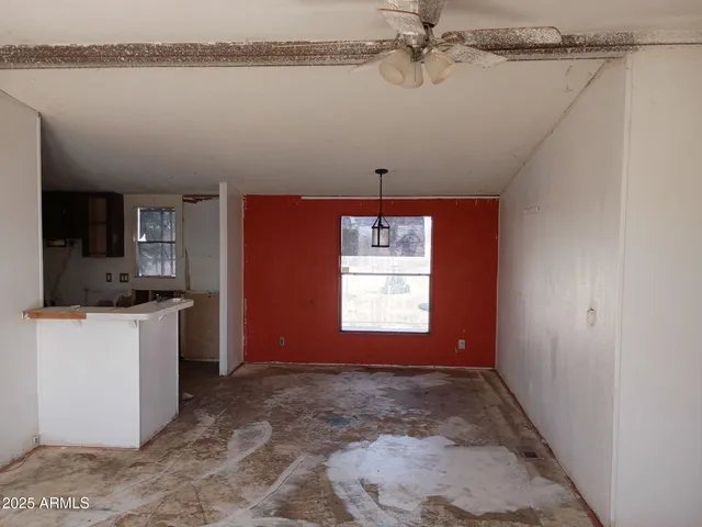 a view of a room with rack and wooden floor