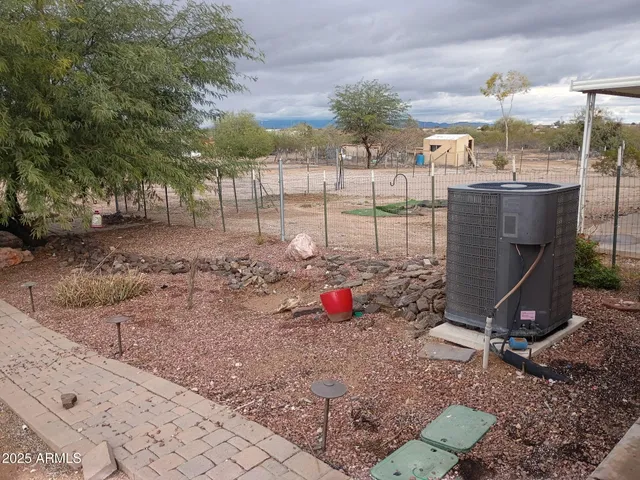 a view of a backyard with sitting area